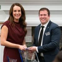 Satkoski posing with award